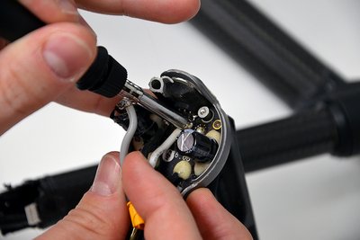 Soldering of a defective connection line of a drone