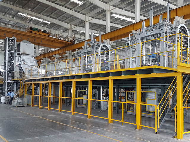 Casting line with platform, holding and degassing station Casting line for the production of structural parts