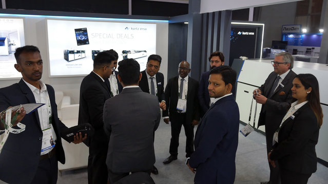 The trade show team getting ready before the show begins at the India Expo Centre The trade show team getting ready before the show begins at the India Expo Centre